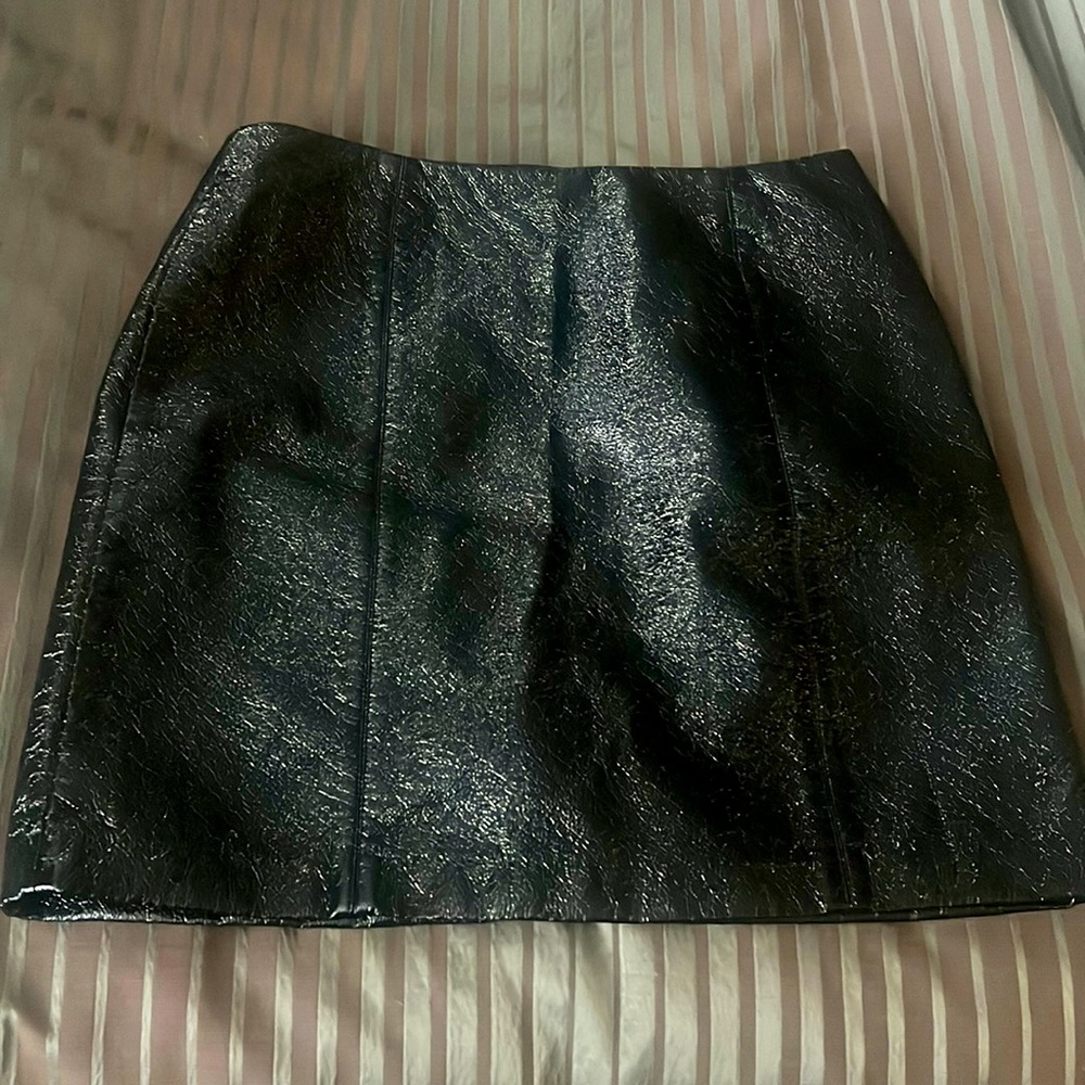 Cutest pleather mini so versatile. Wear it with tights, or a pair of Jordans.